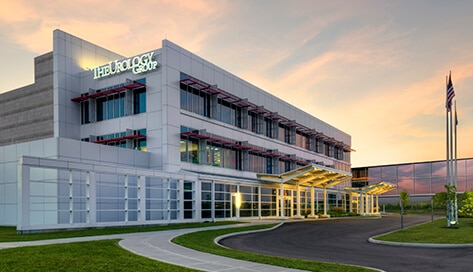 The Urology Group building exterior at sunrise
