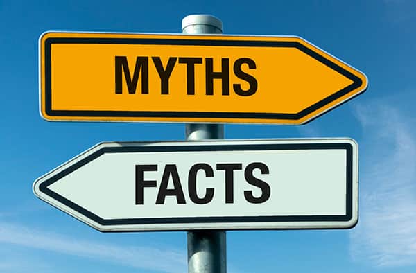Signpost with arrows labeled Myths and Facts